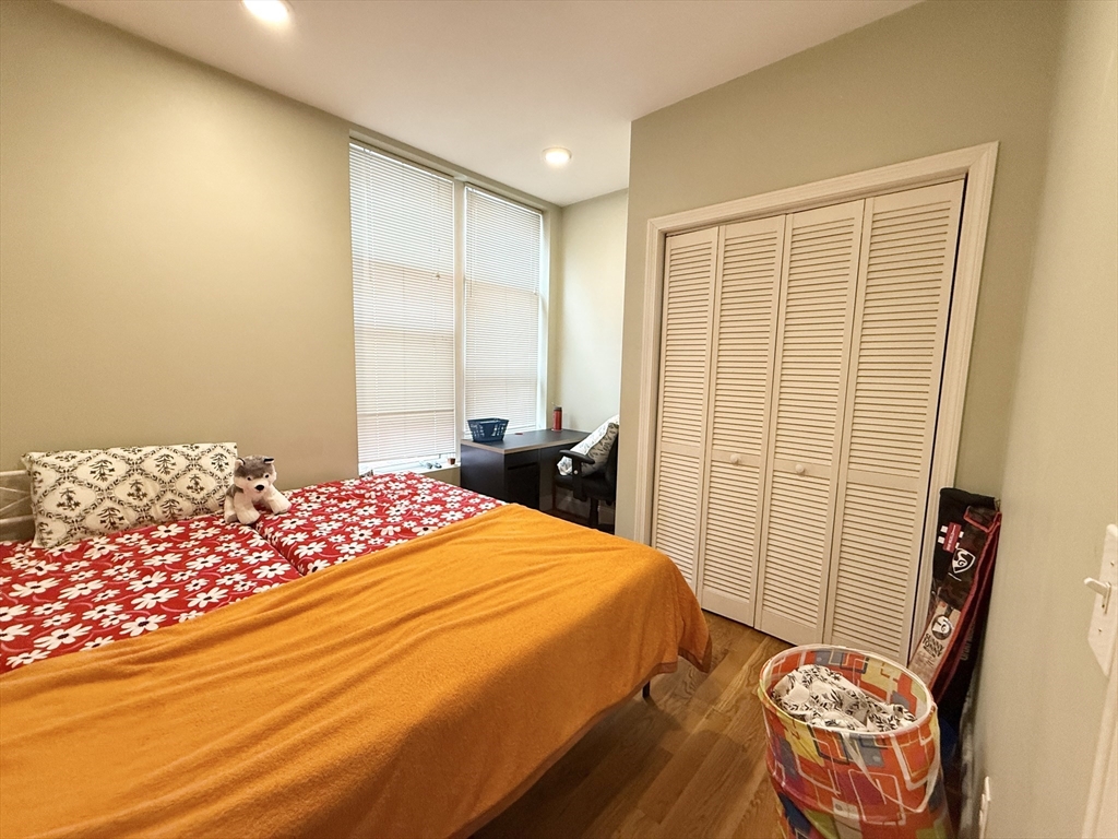 299 Dudley Street, Unit 8 Boston, MA 02119 - Photo 6 of 9 a bedroom with a bed and a window