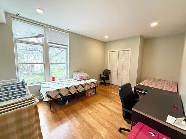 a bed room with a bed and a window