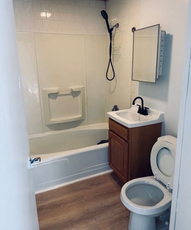 8 Bourne Street, Unit 2R Worcester, MA 01606 - Photo 3 of 5 a bathroom with a toilet a sink and bathtub