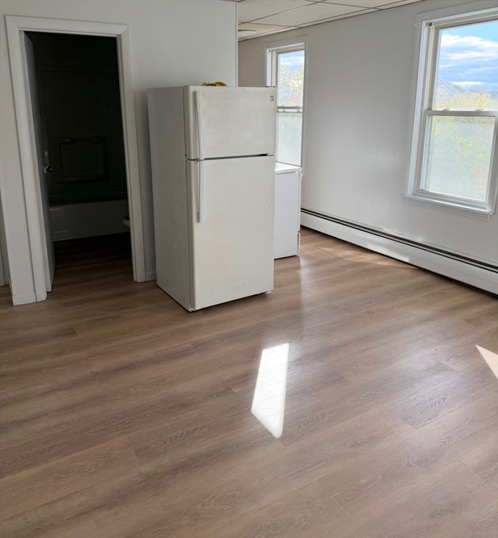 8 Bourne Street, Unit 2R Worcester, MA 01606 - Photo 4 of 5 a view of a kitchen with wooden floor