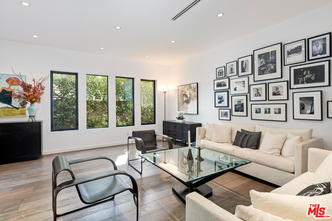 10521 Northvale Road Los Angeles, CA 90064 - Photo 13 of 52 a living room with furniture and floor to ceiling windows