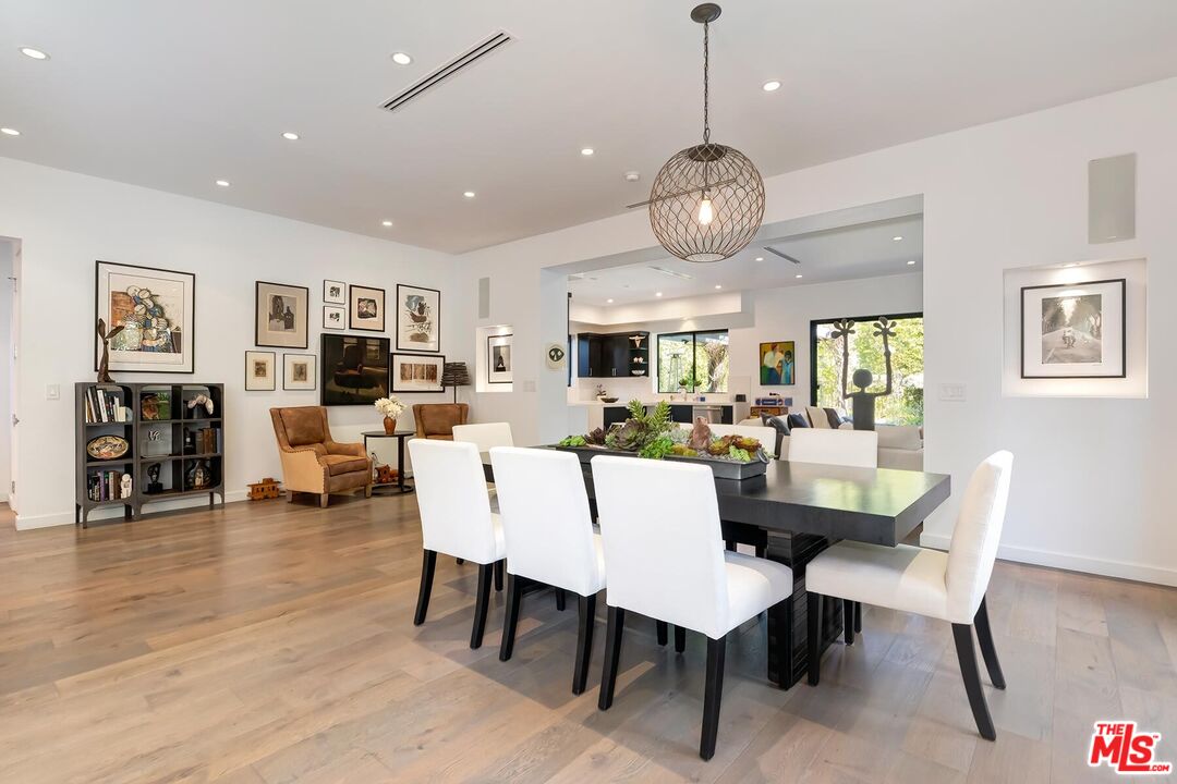 10521 Northvale Road Los Angeles, CA 90064 - Photo 17 of 52 a view of a dining room with furniture and wooden floor