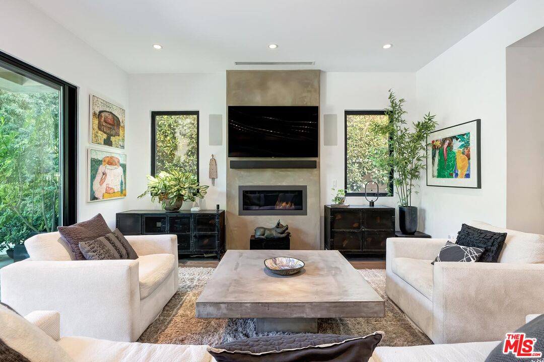 10521 Northvale Road Los Angeles, CA 90064 - Photo 21 of 52 a living room with furniture a flat screen tv and a large window