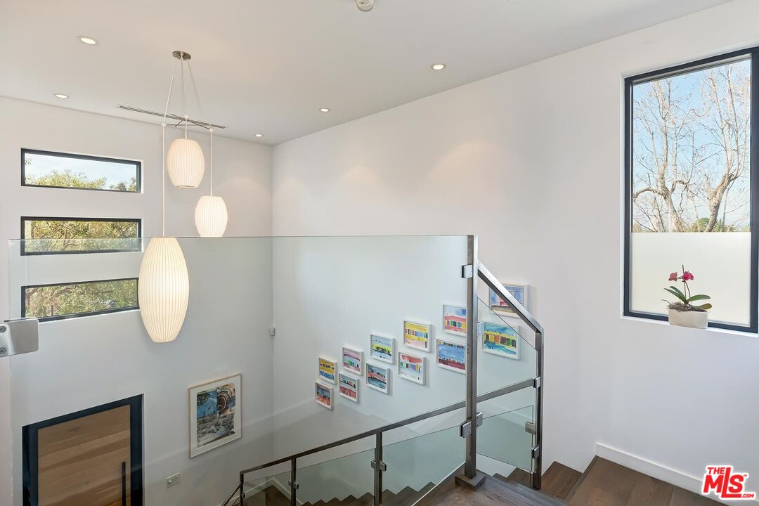 10521 Northvale Road Los Angeles, CA 90064 - Photo 27 of 52 a view of a hallway with paintings on the wall