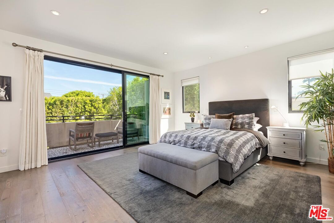 10521 Northvale Road Los Angeles, CA 90064 - Photo 28 of 52 a bedroom with a large bed and a large window