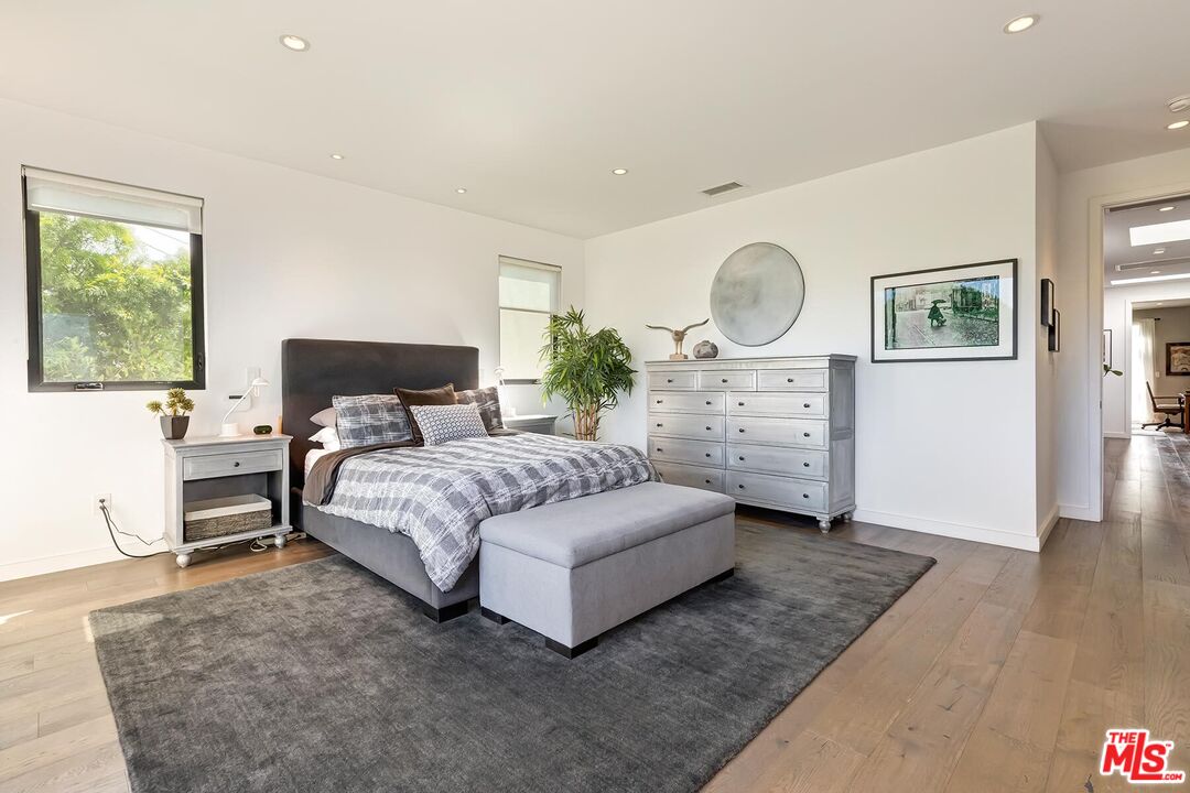 10521 Northvale Road Los Angeles, CA 90064 - Photo 29 of 52 a bedroom with a bed mirror and window