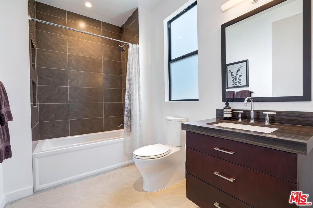 10521 Northvale Road Los Angeles, CA 90064 - Photo 36 of 52 a bathroom with a sink a toilet and shower