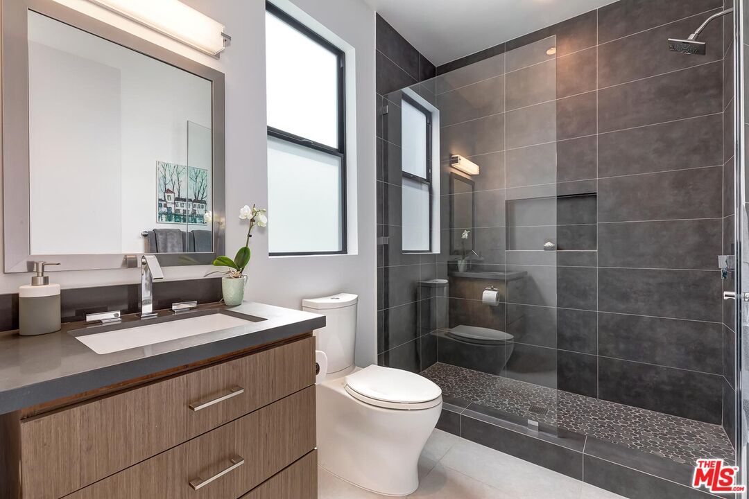 10521 Northvale Road Los Angeles, CA 90064 - Photo 38 of 52 a bathroom with a sink a toilet and shower