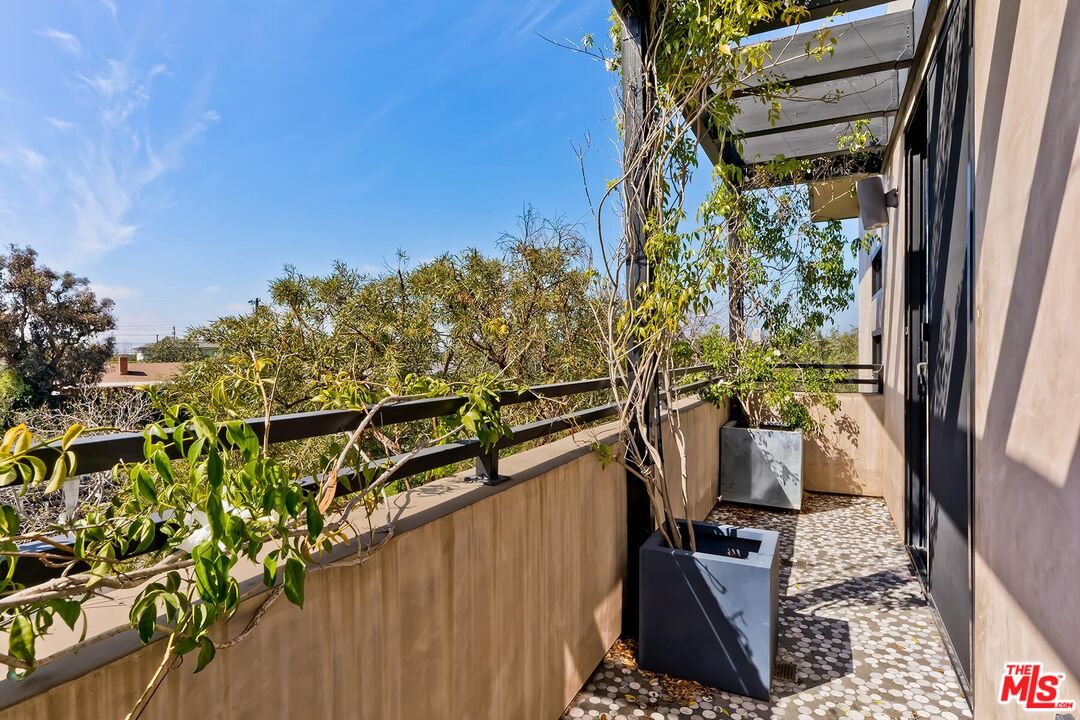 10521 Northvale Road Los Angeles, CA 90064 - Photo 41 of 52 a view of a potted plants next to a wall