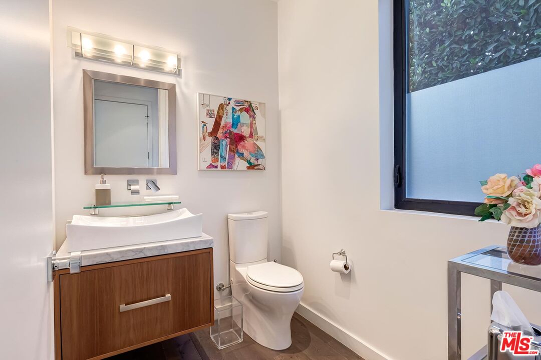 10521 Northvale Road Los Angeles, CA 90064 - Photo 44 of 52 a bathroom with a sink a toilet and a mirror