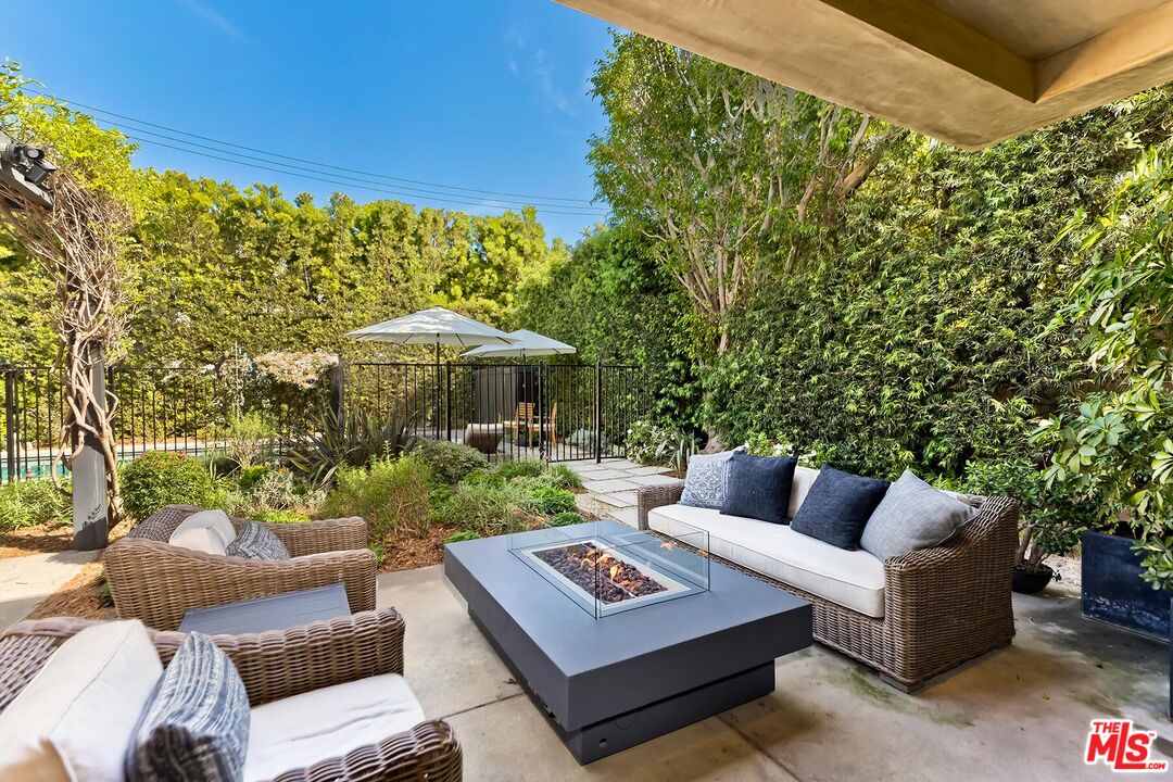 10521 Northvale Road Los Angeles, CA 90064 - Photo 46 of 52 a view of a patio with couches table and chairs and potted plants