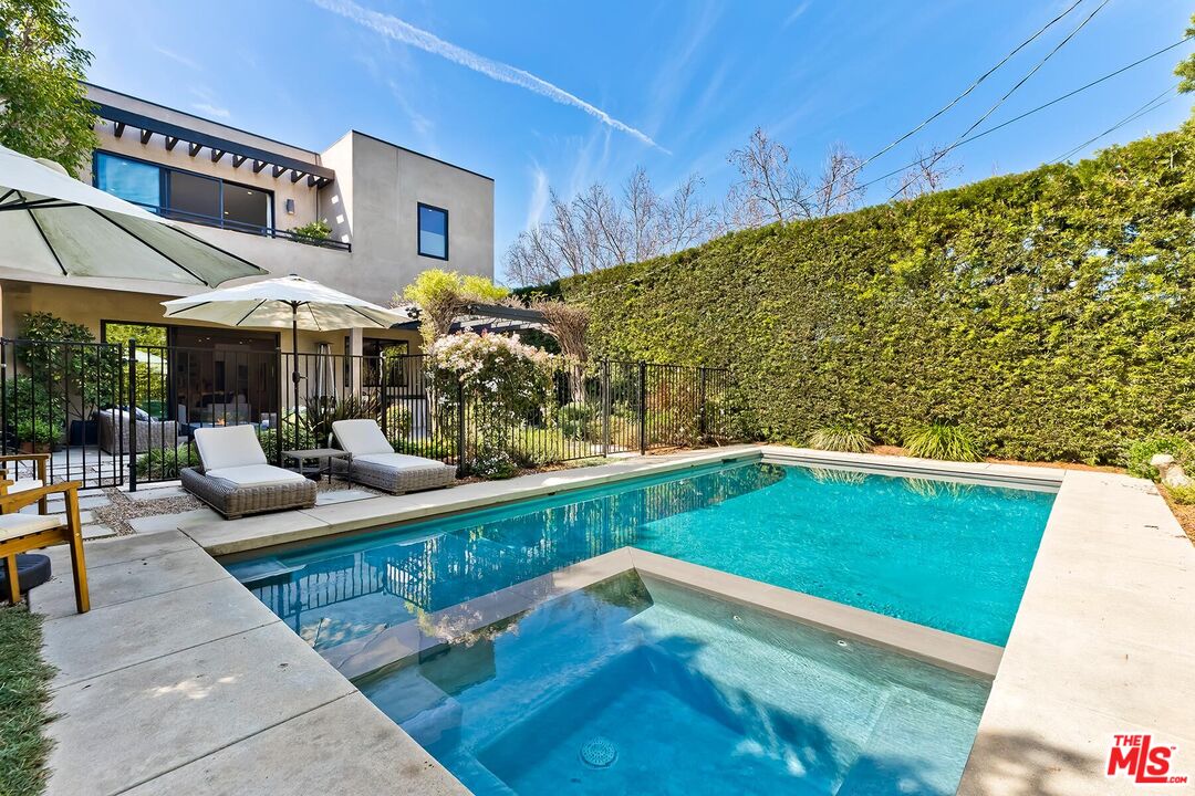 10521 Northvale Road Los Angeles, CA 90064 - Photo 6 of 52 a view of a patio with couches table and chairs with wooden floor and fence