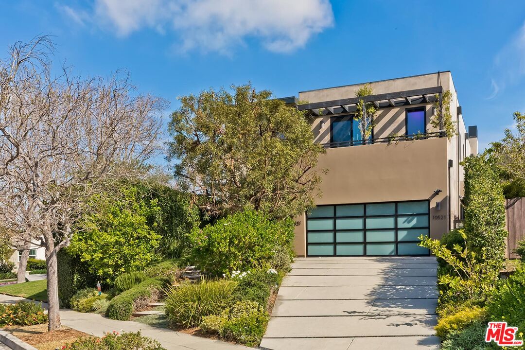 10521 Northvale Road Los Angeles, CA 90064 - Photo 7 of 52 a front view of a house with trees