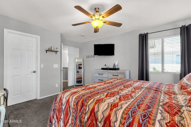 a kitchen with stainless steel appliances granite countertop a sink a stove and a wooden floor