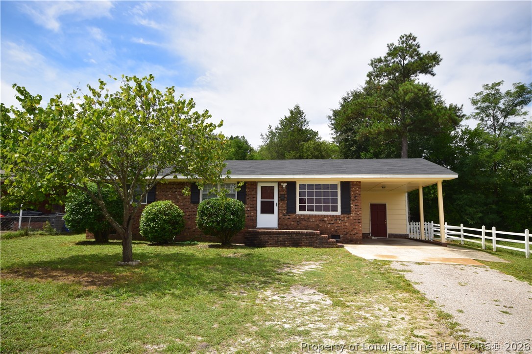 108 South 6th Street Spring Lake, NC 28390 - Photo 1 of 20 a house view with a garden space