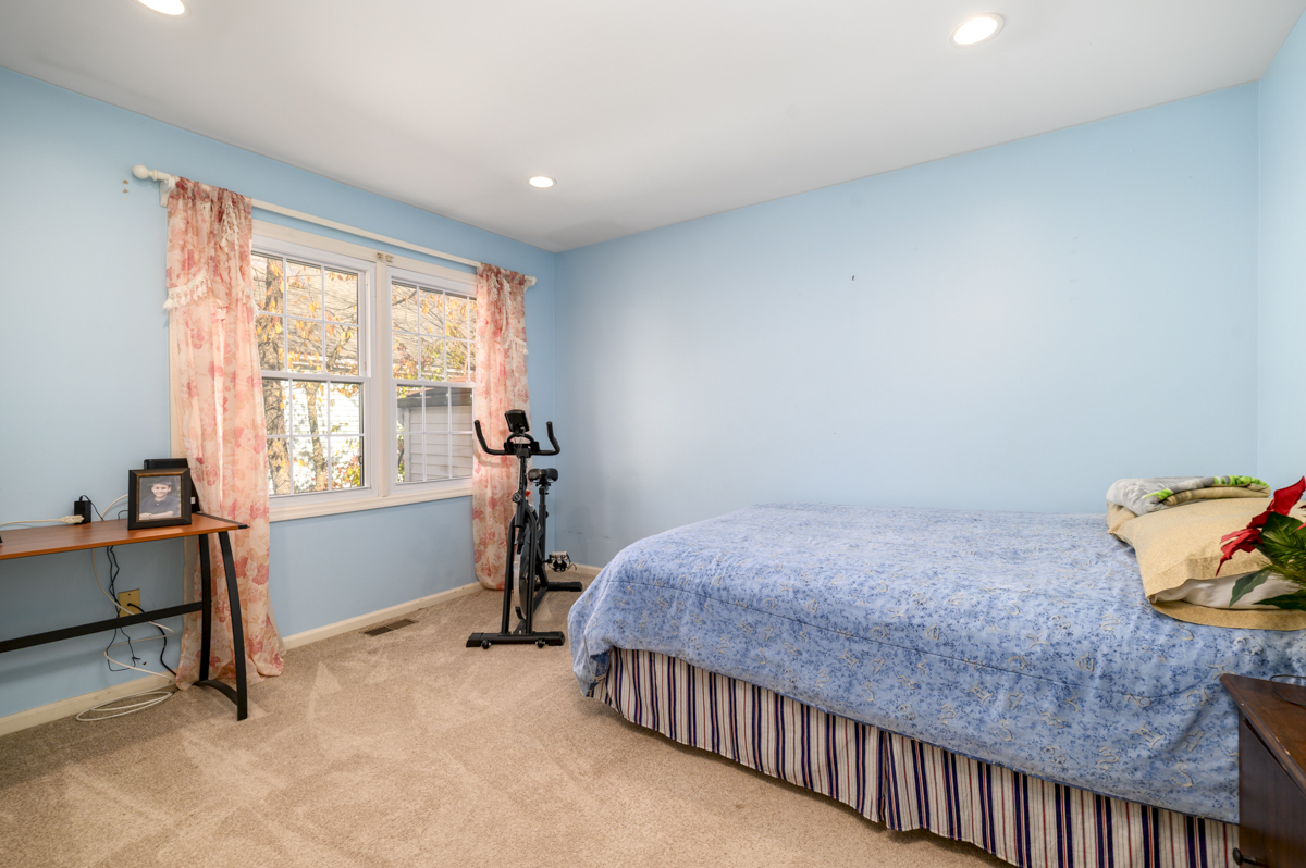 209 Seaside Avenue, Unit 2 Stamford, CT 06902 - Photo 15 of 19 a bed room with a bed and a window