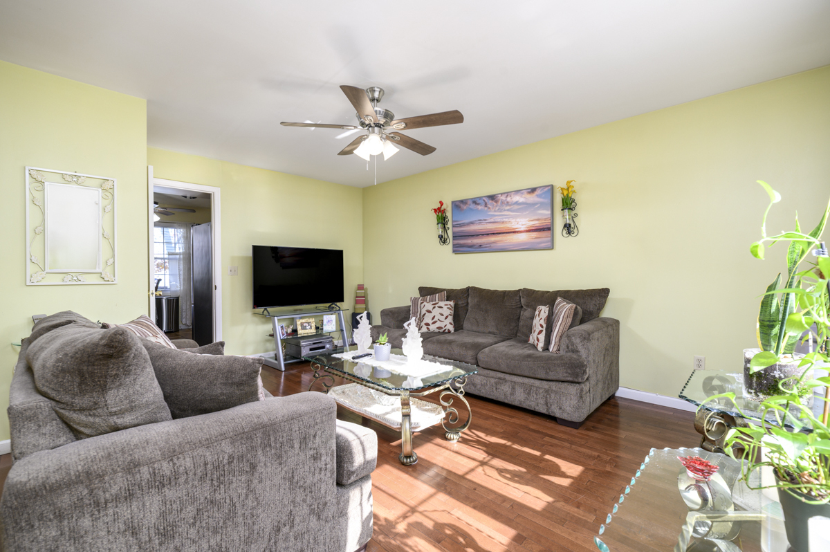 209 Seaside Avenue, Unit 2 Stamford, CT 06902 - Photo 3 of 19 a living room with furniture and a flat screen tv