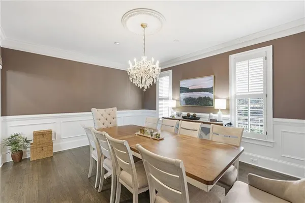 a living room with furniture fireplace and a large window