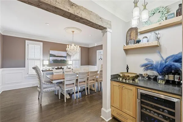 a dining room with furniture and wooden floor