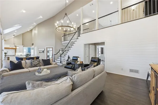 a bathroom with a double vanity sink a mirror and shower