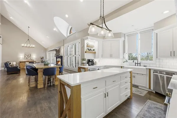 a bedroom with furniture and a flat screen tv