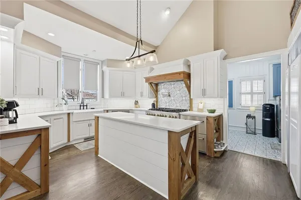 a bathroom with a tub sink and a mirror