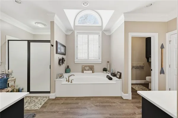 a bathroom with a sink a vanity and a shower