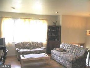 57 Woodland Road Bayville, NJ 08721 - Photo 6 of 6 a living room with furniture and a large window