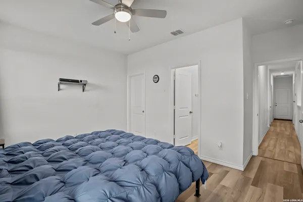 a bedroom with a bed and a view of bathroom