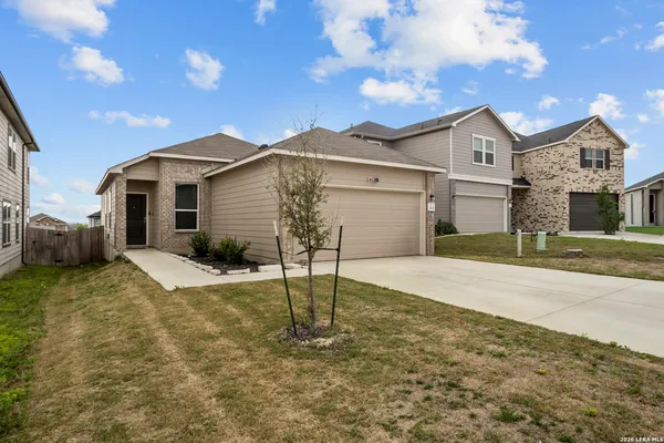 a front view of a house with a yard