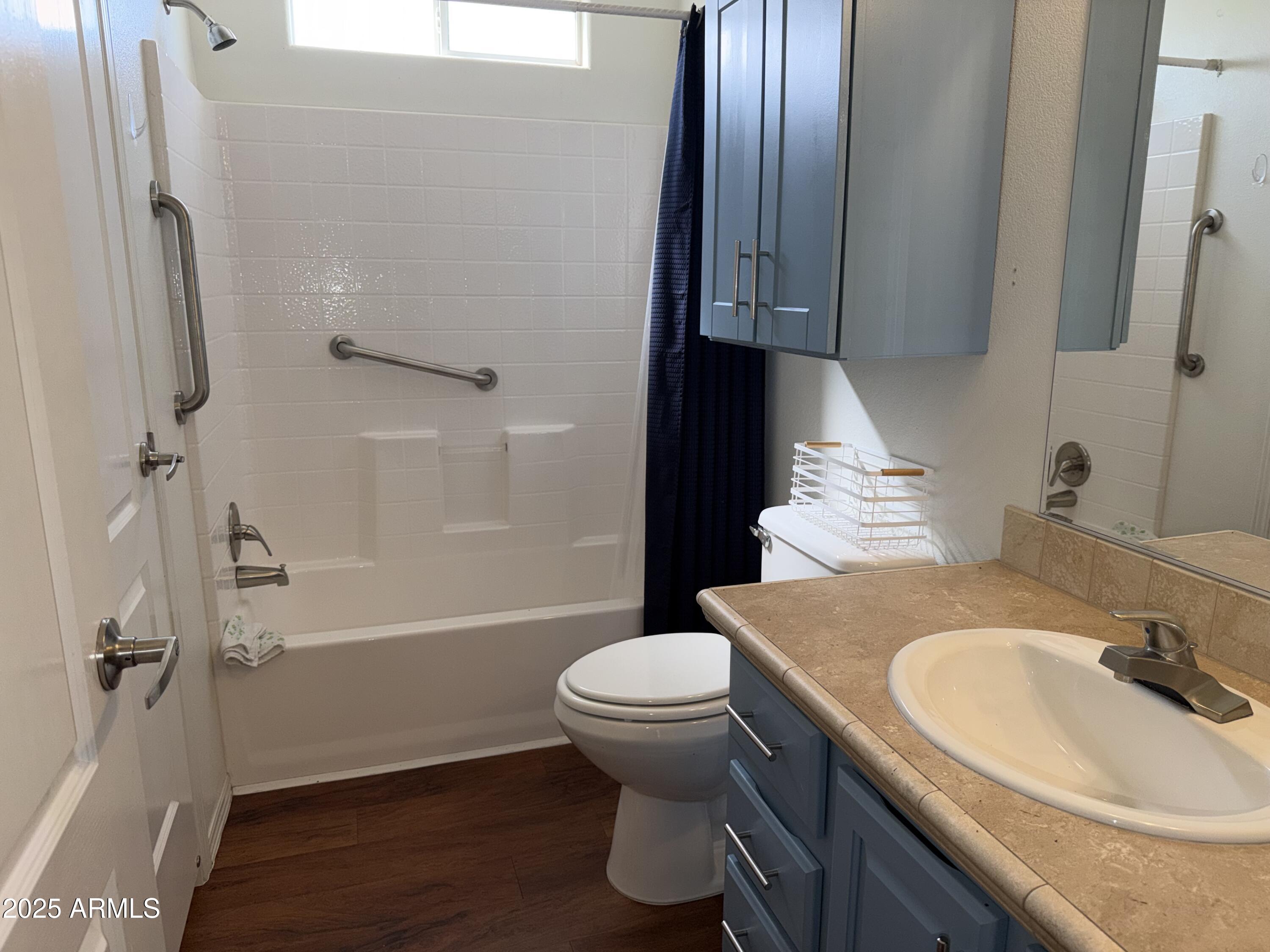 2929 East Main Street, Unit 219 Mesa, AZ 85213 - Photo 16 of 56 a bathroom with a sink toilet and shower