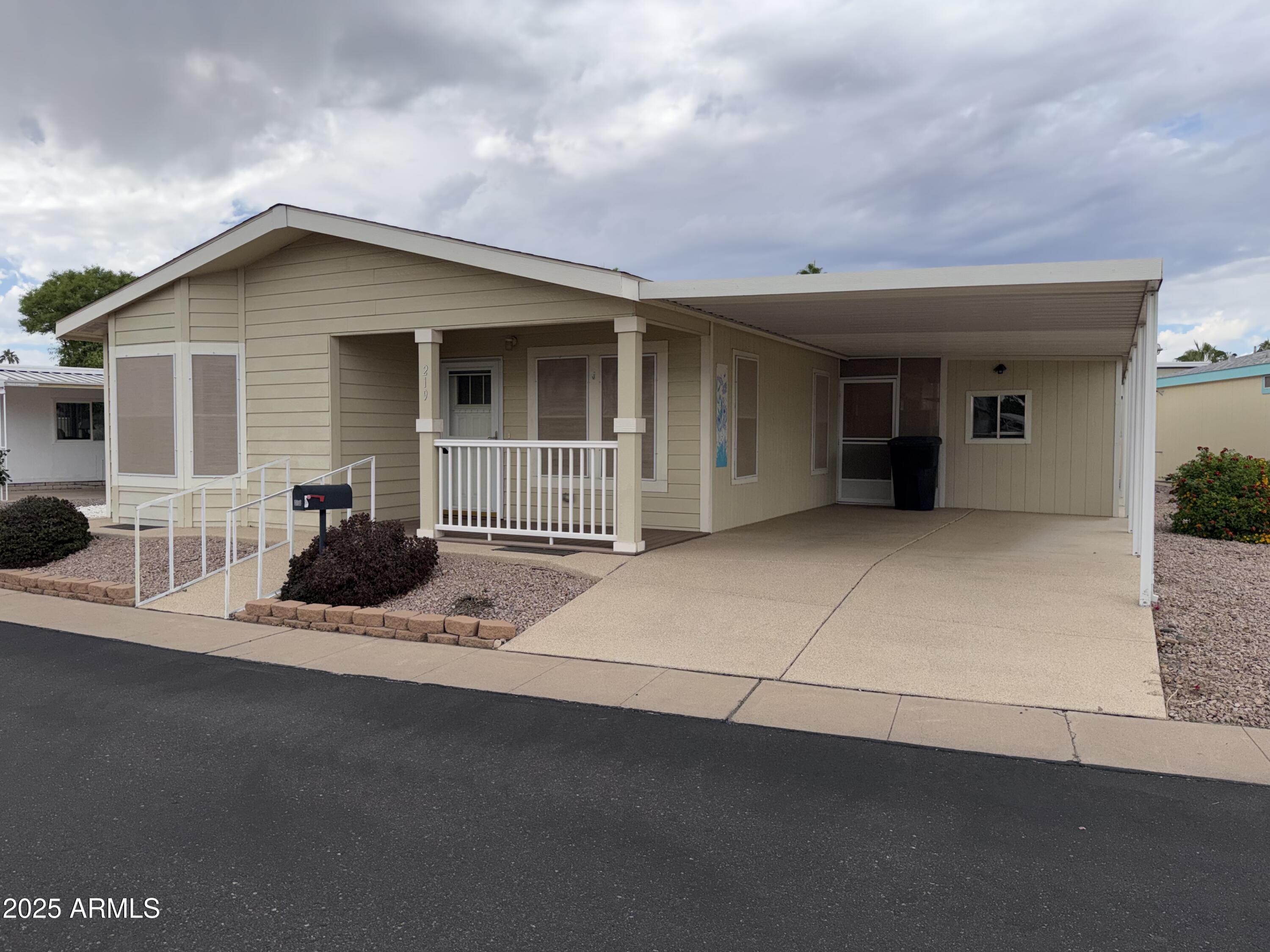 2929 East Main Street, Unit 219 Mesa, AZ 85213 - Photo 2 of 56 a view of a house with backyard space and balcony