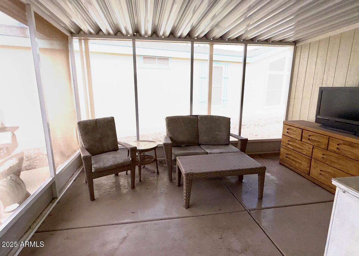 2929 East Main Street, Unit 219 Mesa, AZ 85213 - Photo 23 of 56 a living room with furniture and a flat screen tv