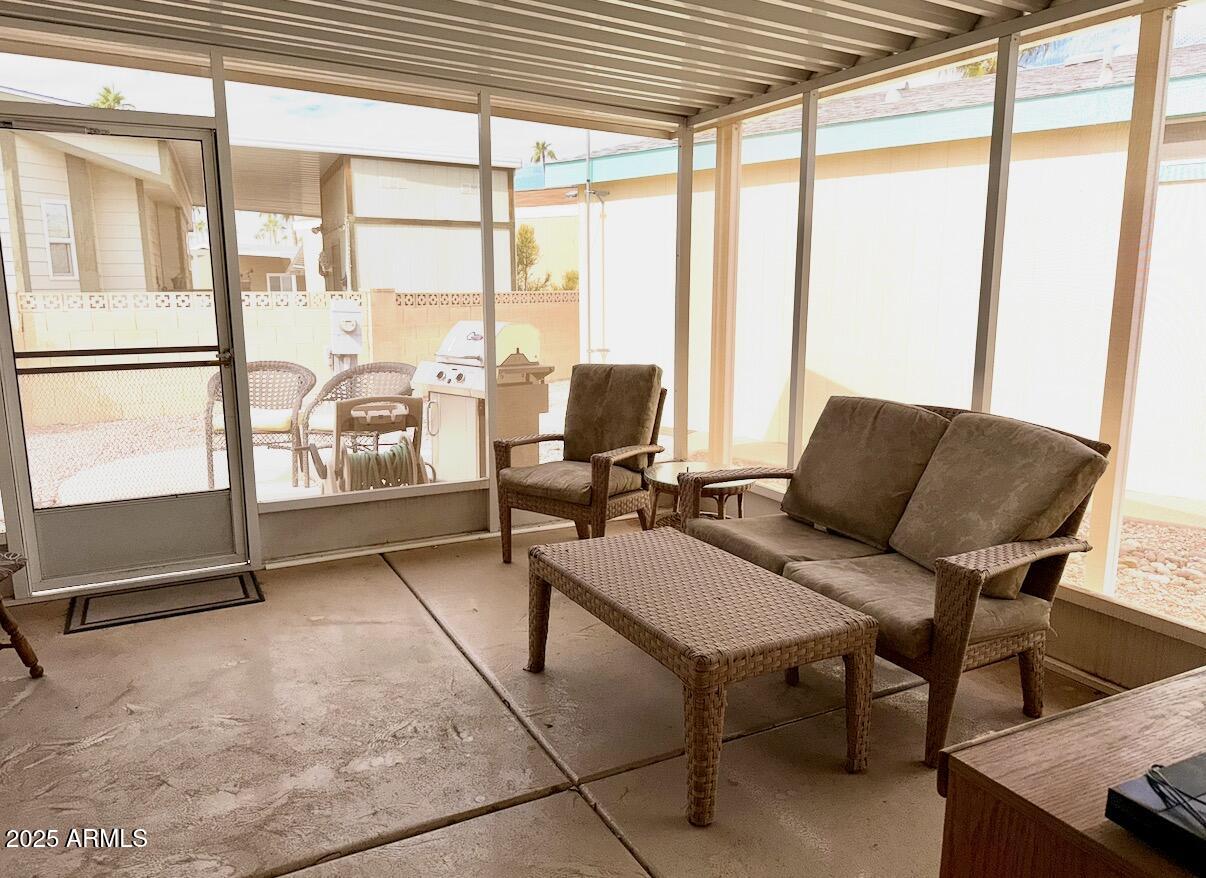 2929 East Main Street, Unit 219 Mesa, AZ 85213 - Photo 24 of 56 a living room with furniture and a window