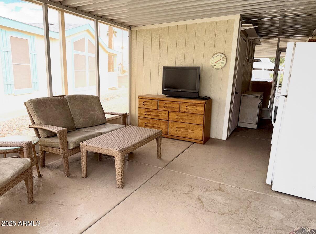 2929 East Main Street, Unit 219 Mesa, AZ 85213 - Photo 25 of 56 a living room with furniture and a flat screen tv