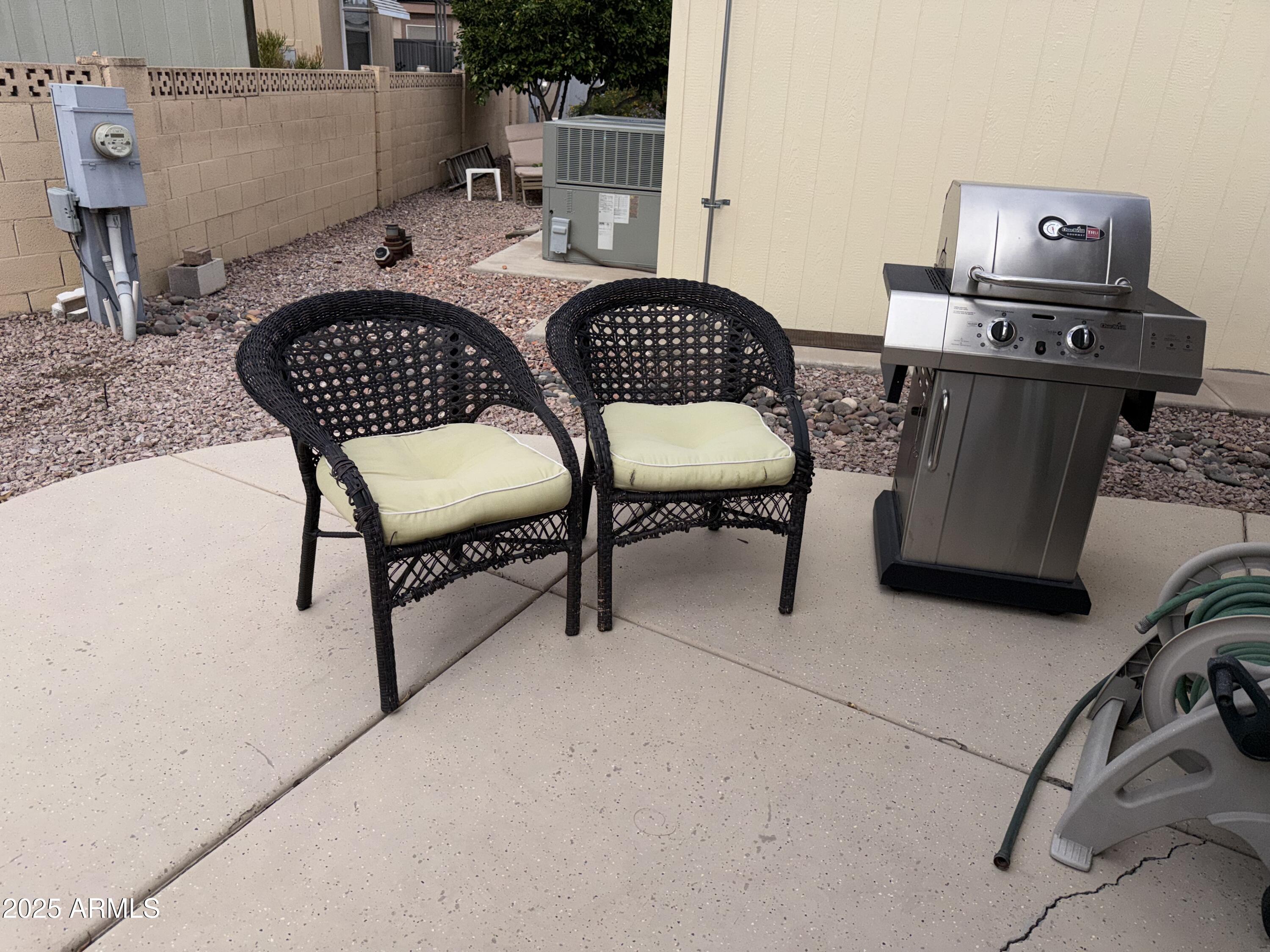 2929 East Main Street, Unit 219 Mesa, AZ 85213 - Photo 26 of 56 a room with furniture a rug and white walls