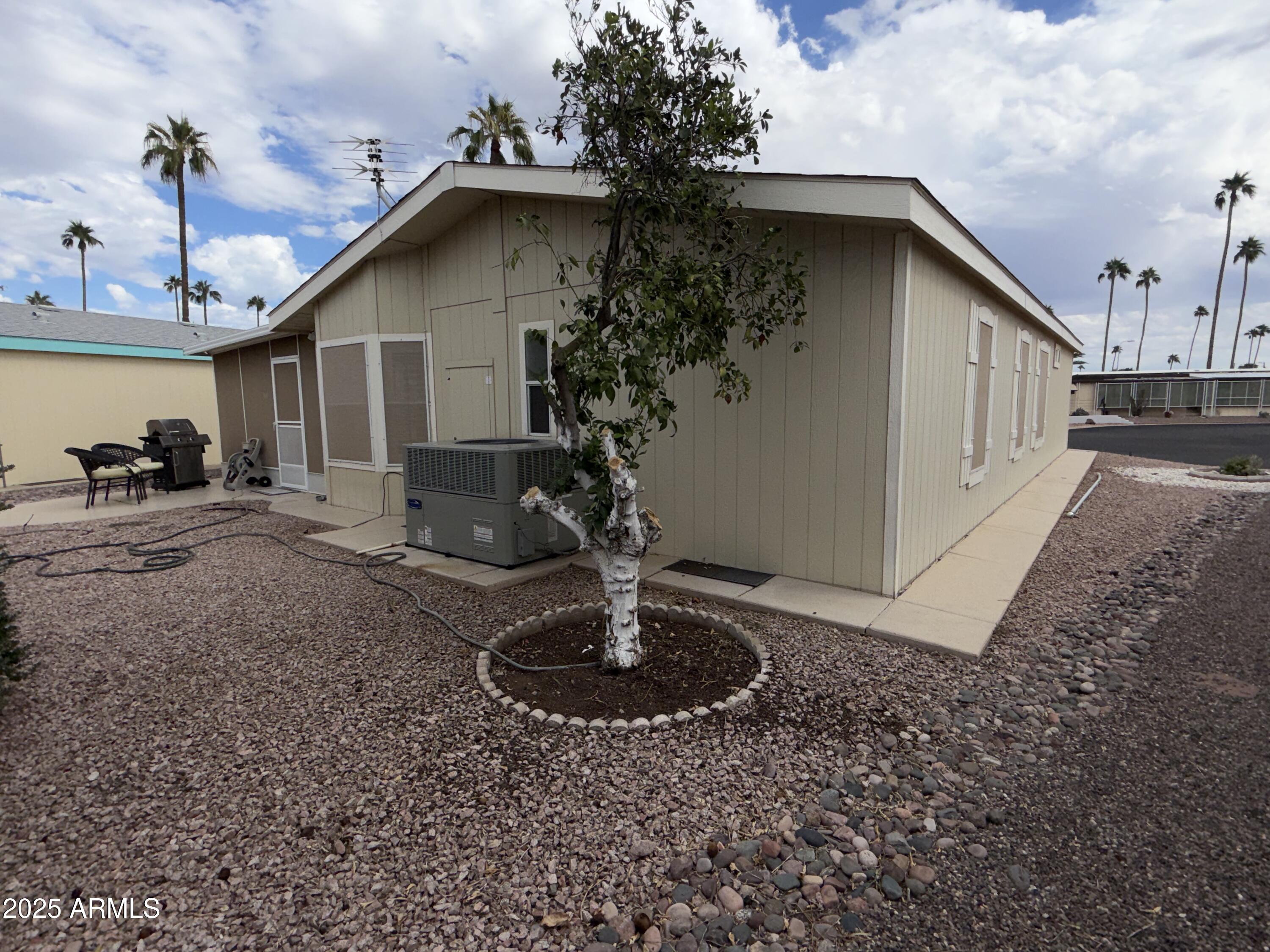 2929 East Main Street, Unit 219 Mesa, AZ 85213 - Photo 28 of 56 a front view of a house with garden