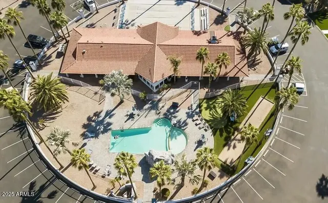 a swimming pool with outdoor seating yard and barbeque oven