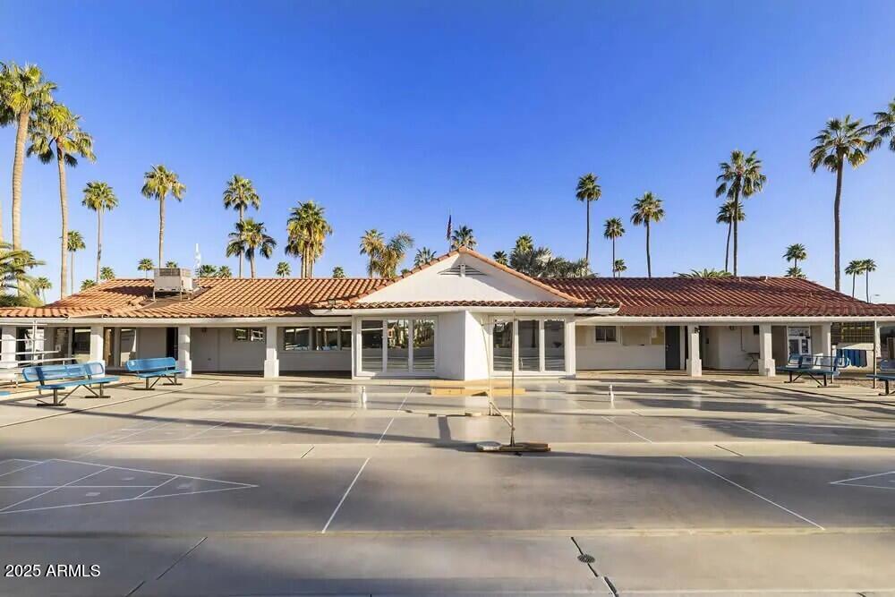 2929 East Main Street, Unit 219 Mesa, AZ 85213 - Photo 35 of 56 a front view of a building with a tree