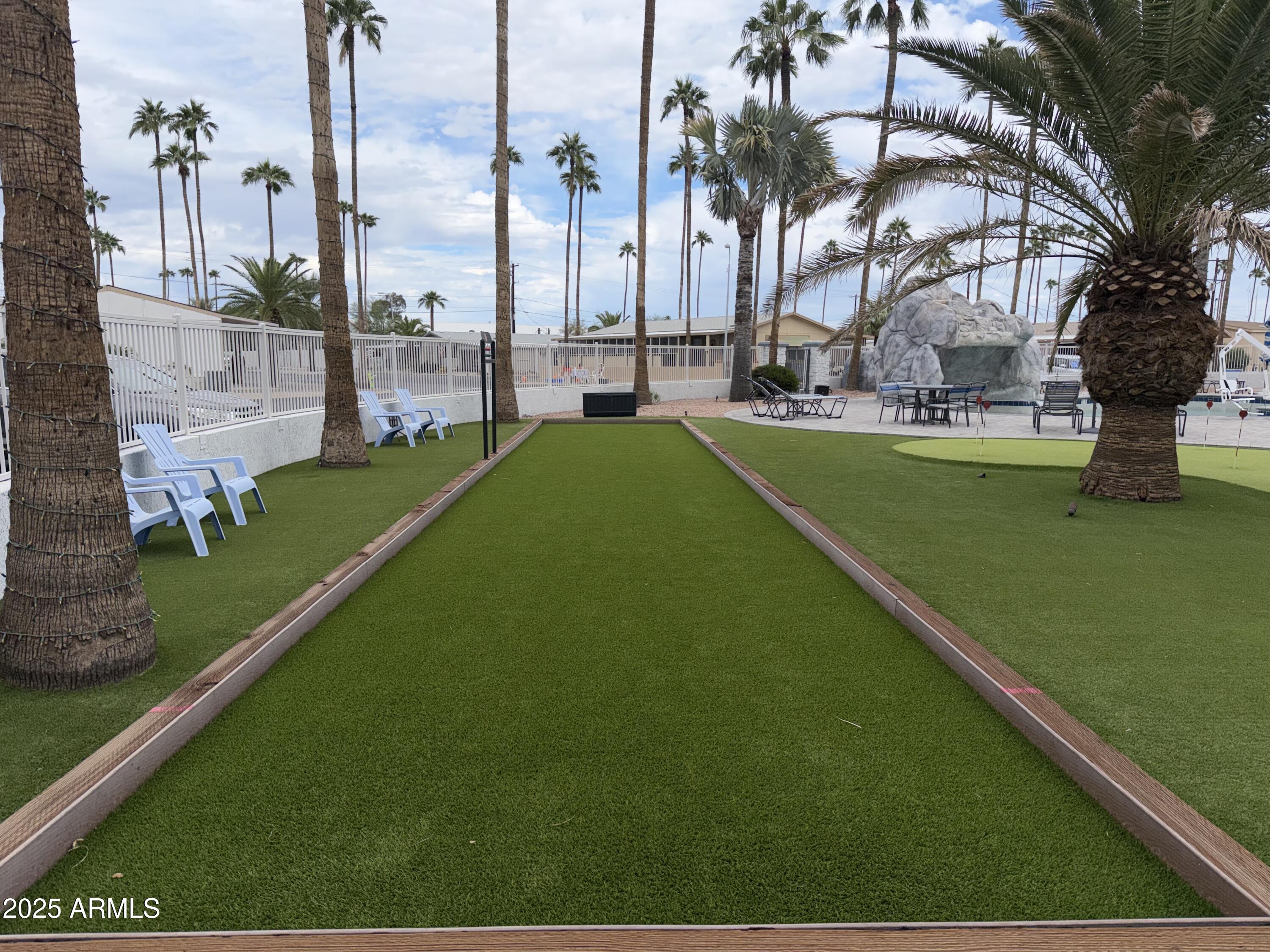 2929 East Main Street, Unit 219 Mesa, AZ 85213 - Photo 43 of 56 a green field with lots of palm trees