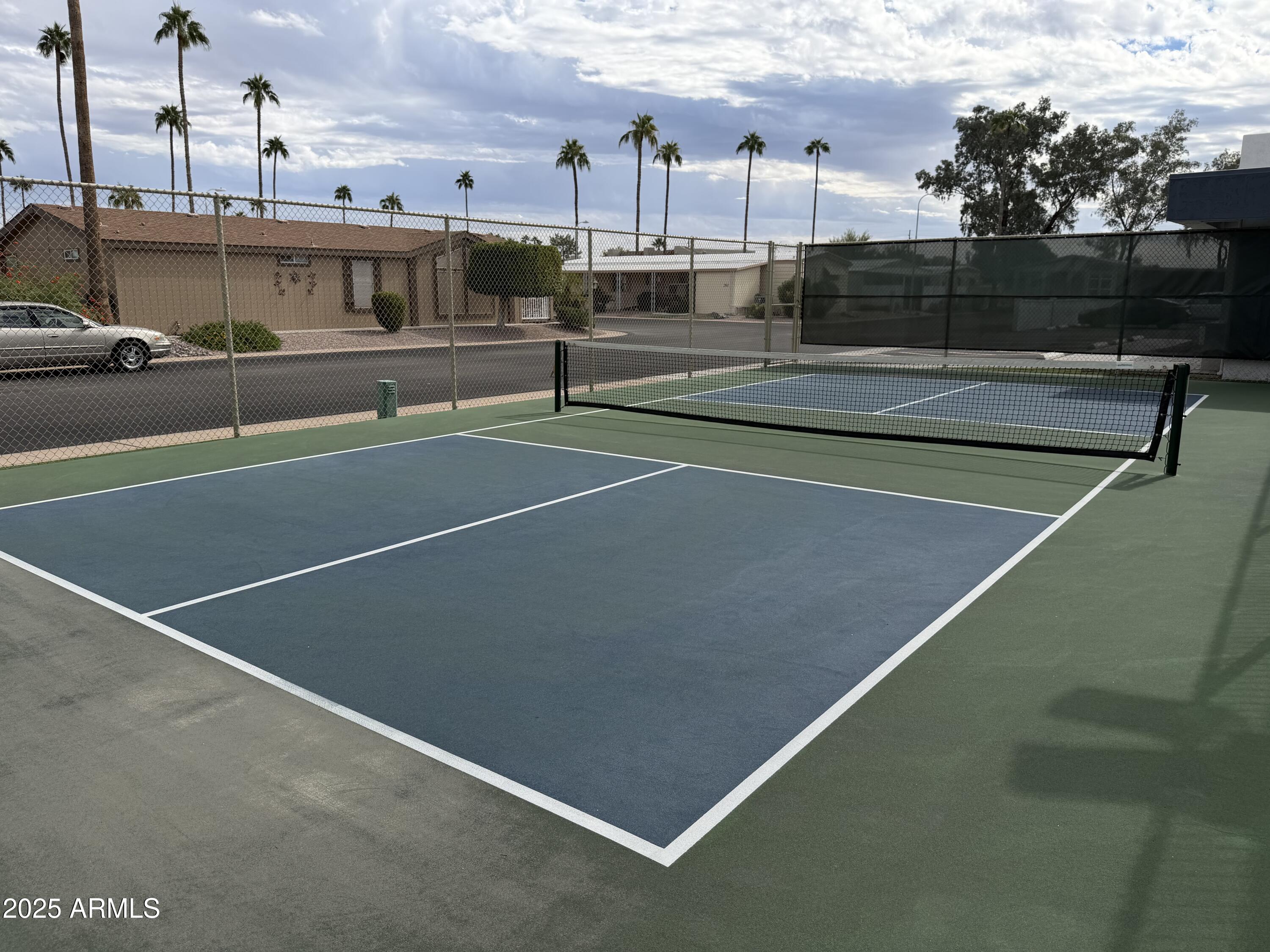2929 East Main Street, Unit 219 Mesa, AZ 85213 - Photo 44 of 56 a view of a tennis court