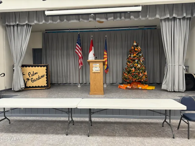 a view of a dining room with furniture and a window