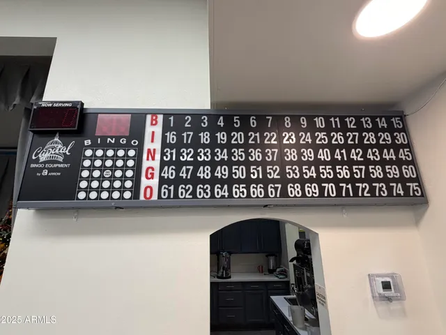 a living room with furniture and large windows