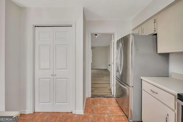 a bathroom with a shower and a sink