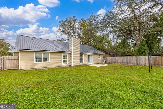 a backyard of a house with lots of green space
