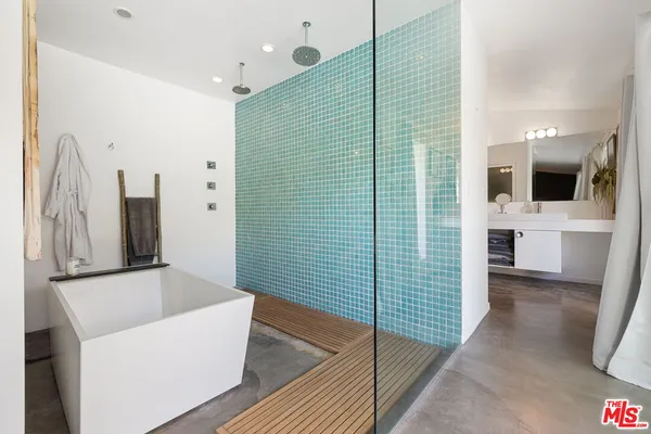 a bathroom with a bathtub and a sink