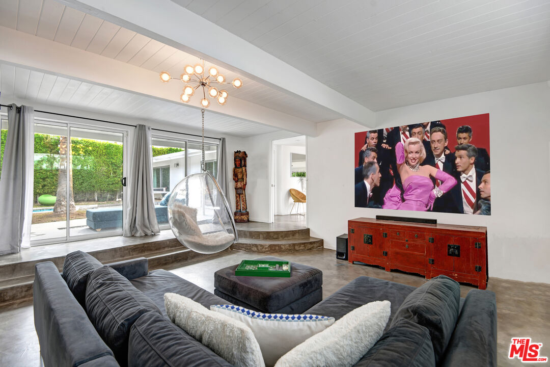 1155 East Mesquite Avenue Palm Springs, CA 92264 - Photo 24 of 32 a living room with furniture and a large window