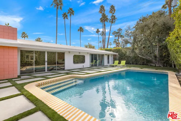 a view of a house with swimming pool