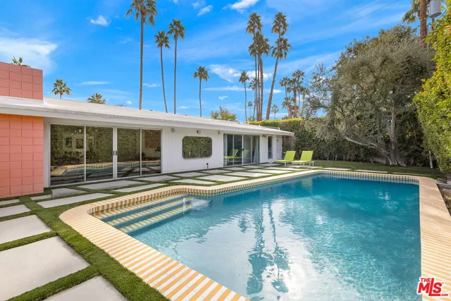 a view of a house with swimming pool