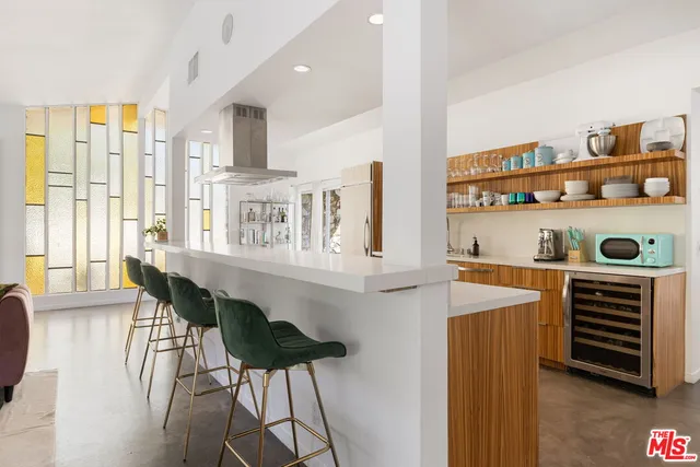 a dining room with furniture and a window